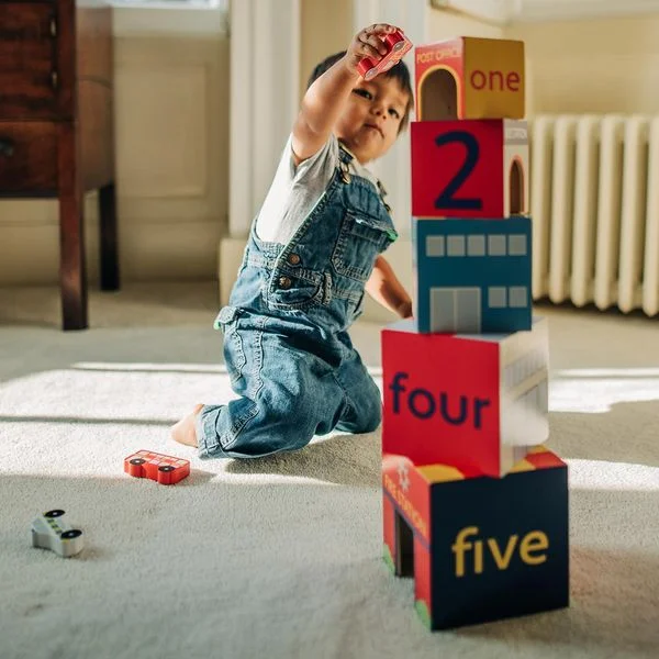 N - Scale Model Train Layout with a City - Themed Background and Animated FiguresOrange Tree Toys - Wooden Stacking Emergency Cubes